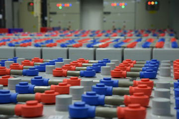 Room with many cables and many batteries.