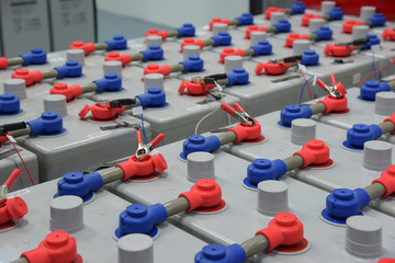 Room with many cables and many batteries.