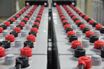 Room with many cables and many batteries.