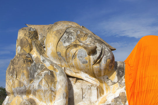 Ruin Old Reclining Buddha Image in Blue Clear Sky