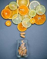 Healthy foods and medicine concept. Bottle of vitamin C and vari