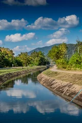 Papier Peint photo Canal Irrigation canal with blue sky