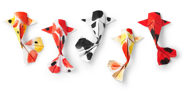 handmade paper craft origami koi carp fish on white background.