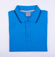 shirt or mens folded polo shirt on background.