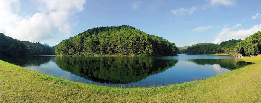Panorama view of reflection of pine trees in Pang Oung Lake, Mae