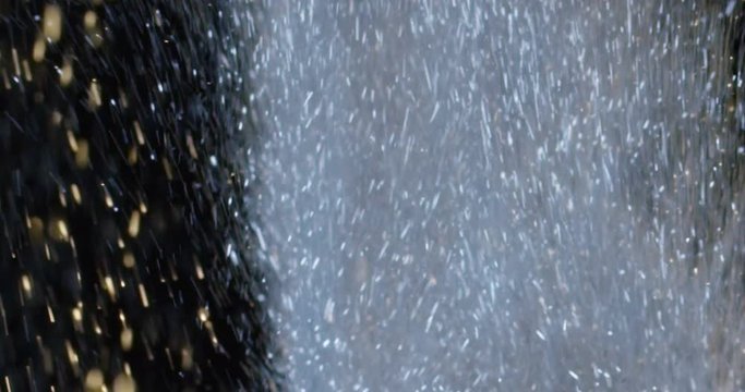 explosions of colored glitters on a black background. concept of party, disco and explosive promotions in the prices of Christmas offers and parties in general. glitters and soft colors.