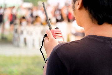 Man with a Walkie Talkie or Portable radio transceiver for communication