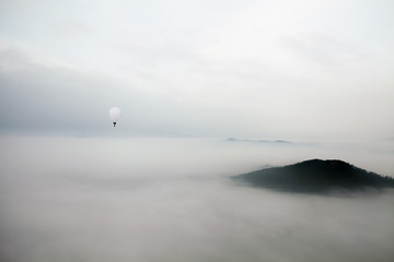 Fly over the clouds with a hot air balloon
- 132392762