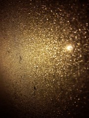 Ice on a window of a car by night