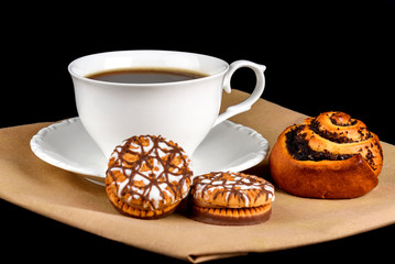 Bun, chocolate chip cookies and a cup of coffee on a white background
