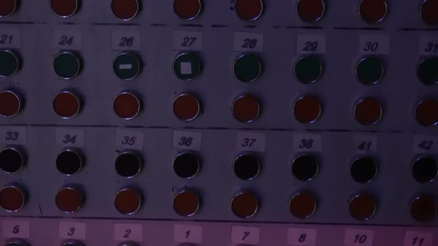 Many multicolored pressbuttons, switches. changing lighting