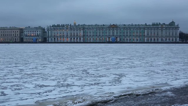 ST. PETERBURG, RUSSIA. Winter view of the ice-covered Neva river and the Winter Palace on the background