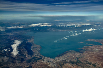The mountains and city on the coast sea, view from the top. Photo from the plane. Turkey. 