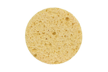 Beige round cosmetic sponge pad for face make-up cleaning, isolated on white background, clipping path included