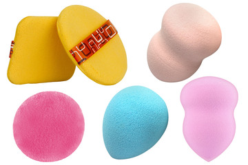 Set of six cosmetic sponge pads for applying and cleaning face make-up, of different shapes and colors, isolated on white background, clipping paths included