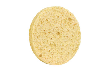 Beige round cosmetic sponge pad for face make-up cleaning, side view, isolated on white background, clipping path included