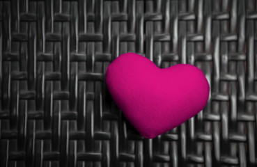 Pink heart on black texture background, Valentine concept