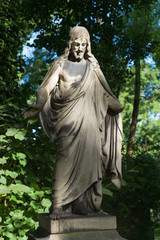 Obraz premium Alter Grabstein mit Christusfigur