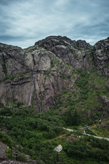 Little white house in a rocky valley.