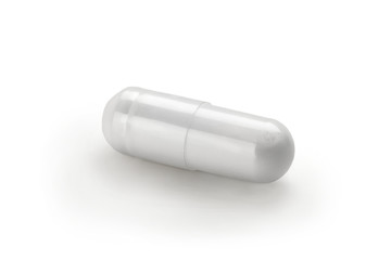White capsule isolated on white background. Close up, copy space, high resolution product. Health care concept