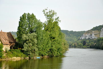 Medieval house next to river in Normandy 