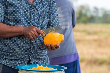 moveing a knife to chop papaya for cooking