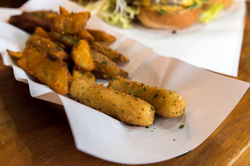 Fried Mozzarella cheese stick with potato wedges