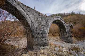 Old Plakida - Kalogeriko arched stone bridge on Vikos canyon, Zagorohoria, Greece. 