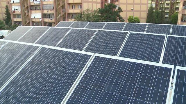 Solar technician installing solar panels