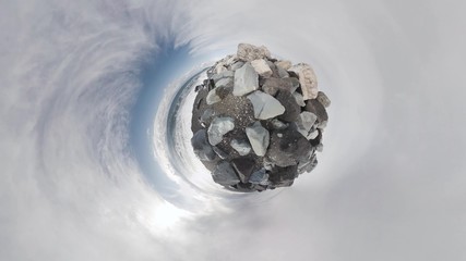 Sea and rocks. Rolling Tiny Little Planet