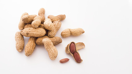 Dried peanuts put on white background