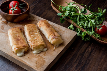 Turkish Pacanga Boregi with pastirma and cheddar (melted) cheese / pastirmali borek