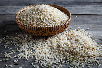 Brown rice, jasmine rice on the wood background