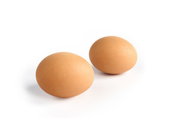 Brown egg on white background