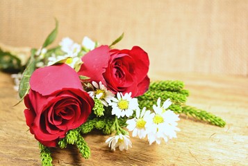 Red roses on the old wooden floor. Special for fans love on Valentine's Day and postcards.