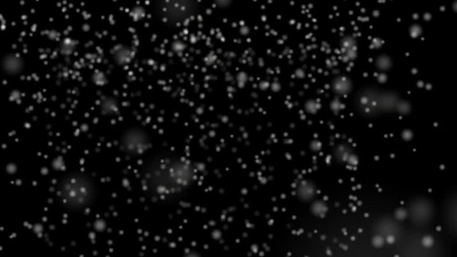 Realistic snowfall with fast speed  isolated on the black background. Seamless loop animation 