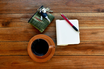 Notebook with Blank Pages, Pen and Cup of Coffee on Wooden Table. Top View
