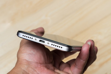 bottom of smartphone , sound port and microUSB port  for charger.