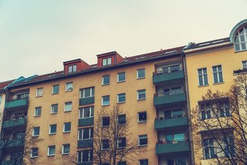 Naklejka premium vintage colored orange apartment houses