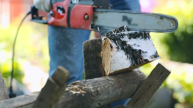 Close-up of working with chainsaw