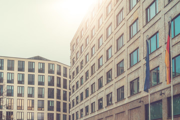 Fototapeta na wymiar modern office buildings with european and german flag