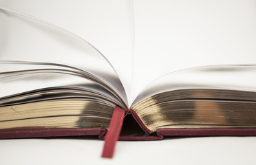 Open antique book with gold cut