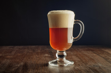 Weissbier on dark wood background