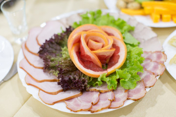 Dinning table set with baked sliced ham