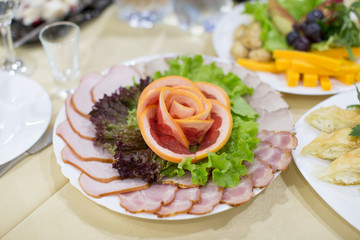 Dinning table set with baked sliced ham