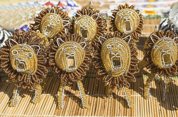 African traditional handmade beads toys animals lions. Local market. South Africa.