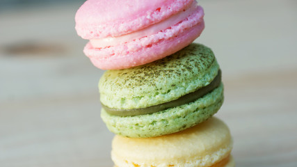 colorful cake macaron or macaroon on wooden background.