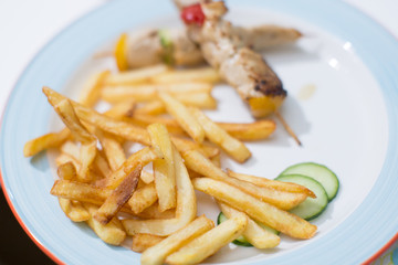 Tasty french fries with barbecue on child birthday