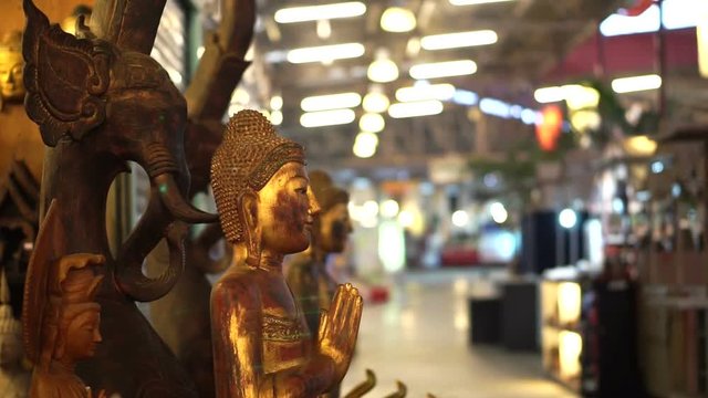 Wood art craft sculptures selling in night market of Thailand