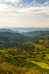 Naklejka na ściany i meble Viewpoint on a landscape of mount Bobija, peaks, hills, meadows and green forests, west Serbia